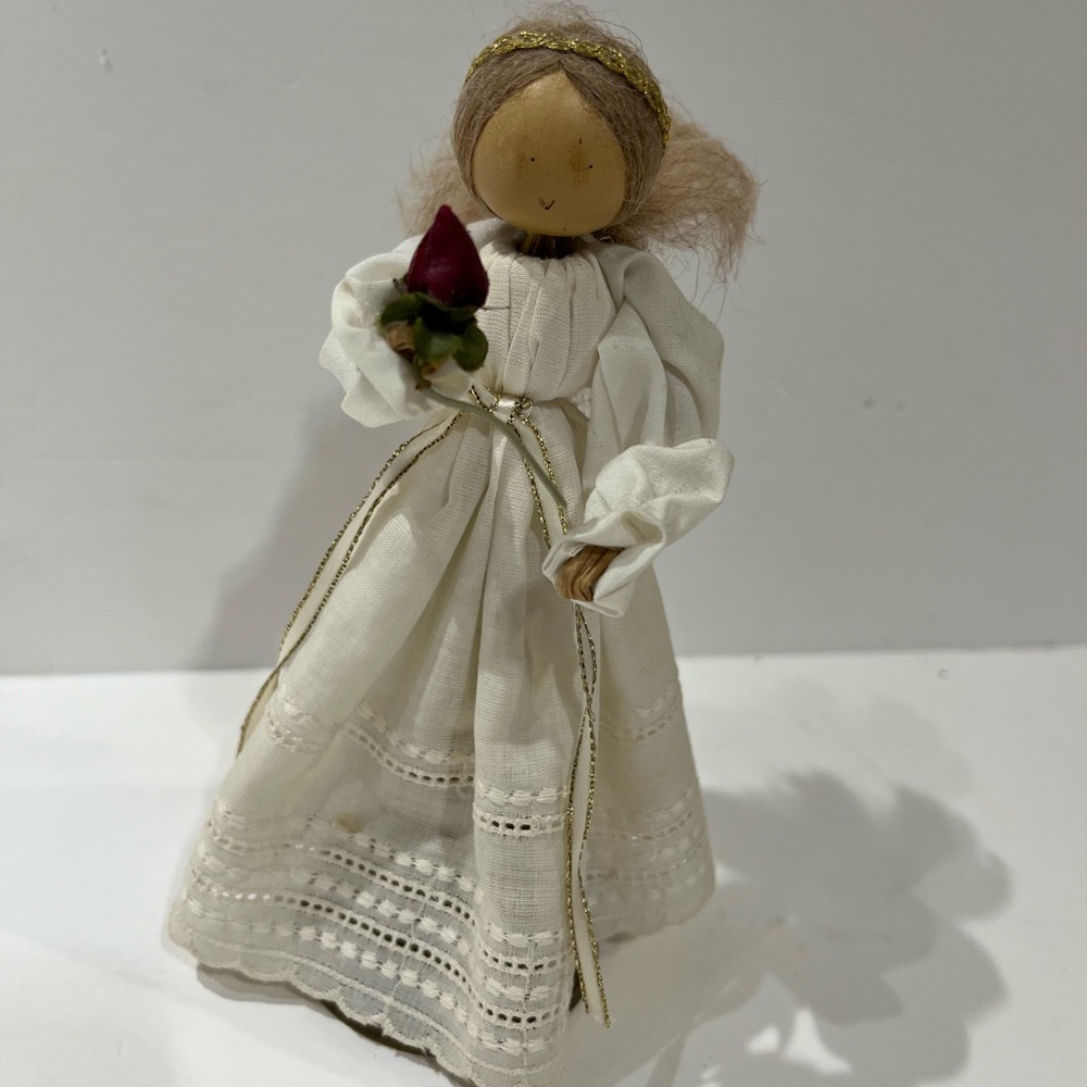 Vintage solid brass bell doll holding rose 🌹. Made in India.  Bell has patina